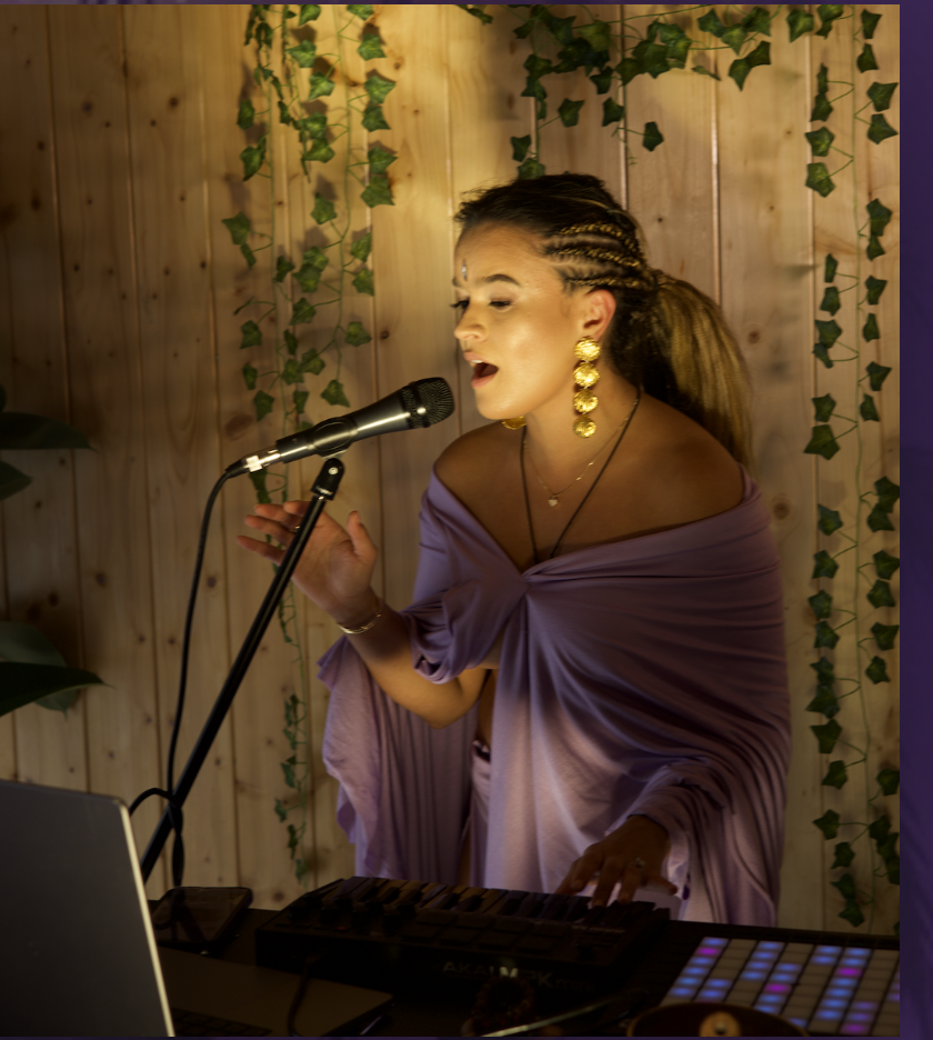 Chika Toro singing and performing live with her instruments