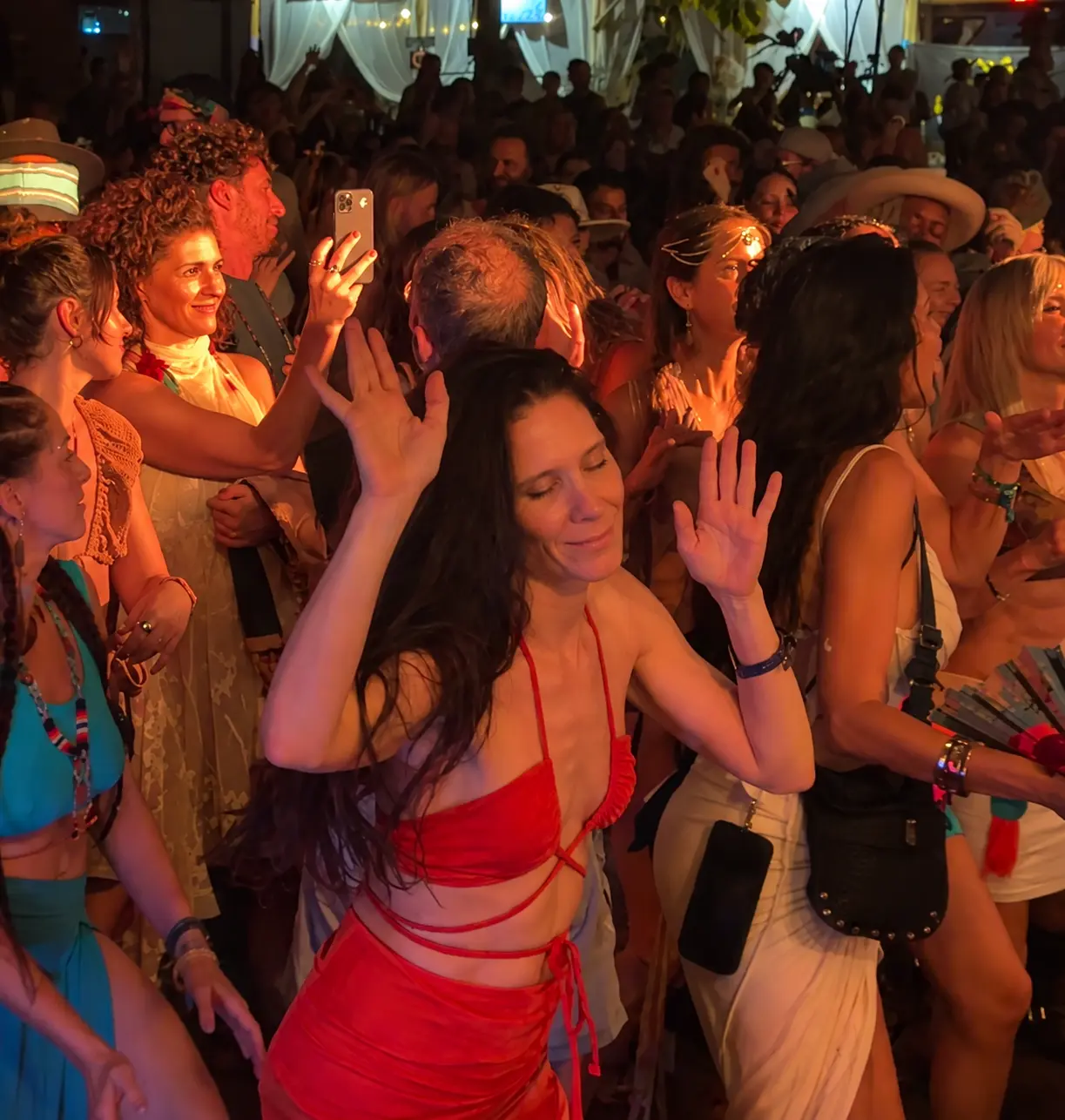 A festival crowd dancing in connection