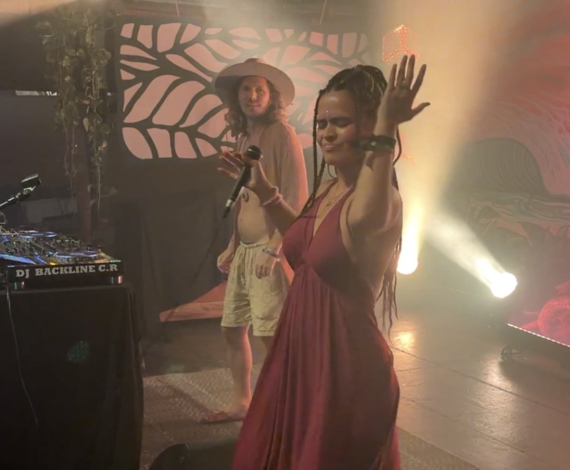 Chika Toro and a musician performing live on stage